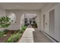 Picturesque outdoor walkway showcases lush landscaping leading to the front door at 5201 S Torrey Pines Dr # 1223, Las Vegas, NV 89118