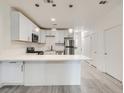 Bright kitchen with stainless steel appliances, modern cabinets, and breakfast bar seating at 5415 W Harmon Ave # 1074, Las Vegas, NV 89103