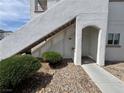 Exterior angle of a multi-level condo with stairs and a sidewalk and a door on the first level at 5650 E Sahara Ave # 1035, Las Vegas, NV 89142