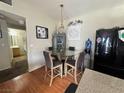 An eat-in kitchen that includes a glass-topped dining table next to the kitchen and stainless steel appliances at 5650 E Sahara Ave # 1035, Las Vegas, NV 89142
