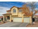 The home is beautifully accentuated by mature landscaping, a red tile roof and a stucco exterior at 6538 Astorville Ct, Las Vegas, NV 89110