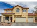A detailed view of the home's stucco exterior with a red tile roof and a three-car garage at 6538 Astorville Ct, Las Vegas, NV 89110