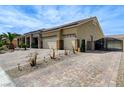 Long brick driveway leads to a three-car garage and gated entrance at 6971 Moaning Cavern St, Las Vegas, NV 89131