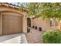 Charming front door with desert landscaping and a covered walkway at 7264 Summer Duck Way, North Las Vegas, NV 89084