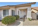Welcoming front entrance with a decorative security door and lush shrubbery at 841 Rusty Anchor Way, Henderson, NV 89002