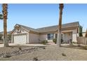 Charming single-story house featuring a tiled roof and desert-style landscaping at 841 Rusty Anchor Way, Henderson, NV 89002