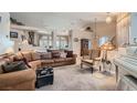Spacious open-concept living room with neutral tones and recessed lighting at 841 Rusty Anchor Way, Henderson, NV 89002