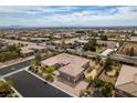 Aerial view of home in a residential area showing mature landscaping, neutral colors, and block wall fencing at 9731 Addie Meadow Ct, Las Vegas, NV 89149