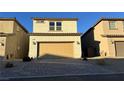 Spacious garage with an inviting stone driveway at 1027 Brilliant Meadow Ave, North Las Vegas, NV 89086