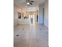 Bright and airy living room featuring tile flooring and natural light at 1655 Morse Arberry Ave, Las Vegas, NV 89106