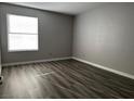 Cozy bedroom featuring hardwood floors and a window at 2451 N Rainbow Blvd # 1156, Las Vegas, NV 89108