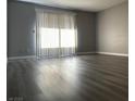 Bright living room featuring hardwood floors and a sliding glass door at 2451 N Rainbow Blvd # 1156, Las Vegas, NV 89108