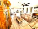 Inviting living room featuring neutral colored furniture, wood laminate floors, and an open floor plan at 2508 Alfa Cir, Las Vegas, NV 89142