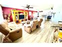 Inviting living room featuring neutral colored furniture, wood laminate floors, and an open floor plan at 2508 Alfa Cir, Las Vegas, NV 89142