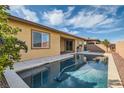 Inviting pool in the backyard, perfect for relaxation and entertaining with blue skies above at 262 Inflection St, Henderson, NV 89011