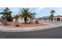 Lovely single-story home featuring desert landscaping and mature trees at 420 Altamira Rd, Las Vegas, NV 89145