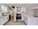 Modern kitchen featuring white cabinets, stainless steel appliances, and stylish countertops, creating a sleek culinary space at 5129 Del Monte Ave, Las Vegas, NV 89146