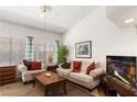 Cozy living room with comfortable seating, bright natural light, and a ceiling fan at 5709 Colwood Ln, Las Vegas, NV 89130