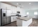 Bright kitchen with stainless steel appliances, island, and ample cabinet space at 600 N Carriage Hill Dr # 2174, Las Vegas, NV 89138