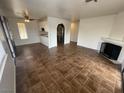 Open-concept living area with tiled floors, fireplace, and kitchen access at 601 Cabrillo Cir # 970, Henderson, NV 89015