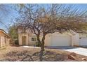Charming single-story home features a xeriscaped front yard with an attached two-car garage at 6312 Monarch Creek St, Las Vegas, NV 89130