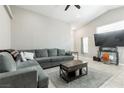 Inviting living room with vaulted ceiling, tile floors, and a comfortable sectional sofa at 6312 Monarch Creek St, Las Vegas, NV 89130