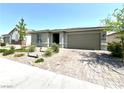 Attractive single-story home boasts desert landscaping and a paver driveway at 6436 Linden St, North Las Vegas, NV 89086