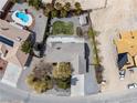Bird's eye view showcasing the property's layout, neighboring homes, and outdoor features at 6860 Stubblefield Dr, Pahrump, NV 89061