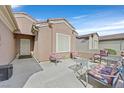 Inviting outdoor patio space with comfortable seating, perfect for relaxation and entertaining guests at 7741 Fruit Dove St, North Las Vegas, NV 89084