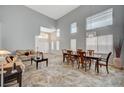 Bright open-concept living and dining area with soaring ceilings and natural light at 851 Brunellos Ave, Las Vegas, NV 89123