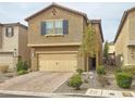 Attractive two-story home with a spacious two-car garage and neatly manicured landscaping at 9327 Ettrick Ct, Las Vegas, NV 89178