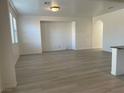 Spacious living room with light wood flooring and an open floor plan at 953 Via Gandalfi, Henderson, NV 89011