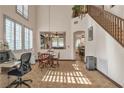 Bright dining area with tile flooring, large windows, and views into other living spaces at 9768 Northern Dancer Dr, Las Vegas, NV 89117