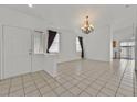 Bright living room featuring tile flooring, neutral decor, and an open layout with recessed lighting at 100 Beaver Falls Ave, Las Vegas, NV 89123