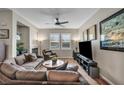 Inviting living room features hardwood floors, neutral paint, and a cozy fireplace at 1012 Domnus Ln # 105, Las Vegas, NV 89144