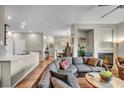Open-concept living area features hardwood floors, neutral paint, and a cozy fireplace at 1012 Domnus Ln # 105, Las Vegas, NV 89144