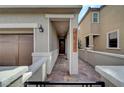 Inviting walkway leading to a welcoming front door with decorative wreath at 10397 Skye Canyon Falls Ave, Las Vegas, NV 89166