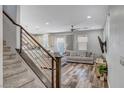 Open-concept living room showcasing hardwood floors and abundant natural light at 10397 Skye Canyon Falls Ave, Las Vegas, NV 89166