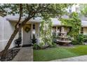 Inviting front entrance featuring a decorative wreath, lush greenery, and a charming water fountain at 1301 Kingdom St, Las Vegas, NV 89117