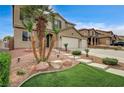 Charming two-story home with a landscaped yard and a welcoming entrance at 2265 Stone Breeze Ave, North Las Vegas, NV 89031