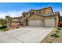 Beautiful two-story home with a three-car garage and extended driveway at 2265 Stone Breeze Ave, North Las Vegas, NV 89031