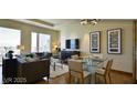 Cozy living and dining area with floor-to-ceiling windows and stylish furniture at 3750 Las Vegas Blvd # 3510, Las Vegas, NV 89158