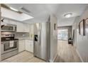 Bright kitchen with gray subway tile and modern appliances at 3823 S Maryland Pkwy # T8, Las Vegas, NV 89119
