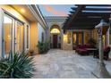 Charming outdoor courtyard with comfortable seating and a lovely pergola at 5 Circa De Montanas, Henderson, NV 89011