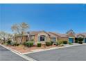 A quiet street features appealing one-story homes with tidy front yards and attached garages at 5245 Sand Dollar Ave, Las Vegas, NV 89141