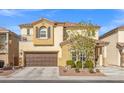 Inviting two-story home with a brown garage door, desert landscaping, and a charming entryway at 7078 Seabirds Pl, North Las Vegas, NV 89084