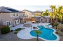 Aerial view of the resort-style backyard featuring a pool, spa, patio, and a pool house at 7338 Flying Pegasus Ct, Las Vegas, NV 89131