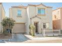 Charming two-story home featuring a garage, a cozy front porch, and a well-maintained yard at 7649 Calico Fields St, Las Vegas, NV 89149