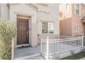 Inviting front porch with decorative railing, leading to a well-maintained front door and charming facade at 7649 Calico Fields St, Las Vegas, NV 89149