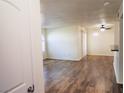 Spacious living room features wood-look floors and lots of natural light at 9325 W Desert Inn Rd # 110, Las Vegas, NV 89117